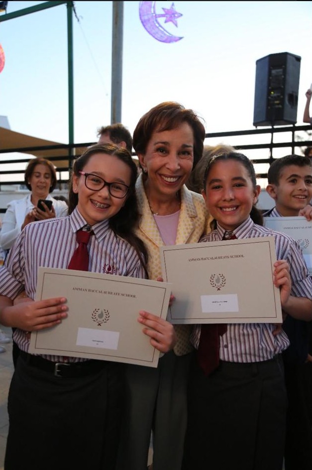 With my granddaughters Aysha and Zein at a school event